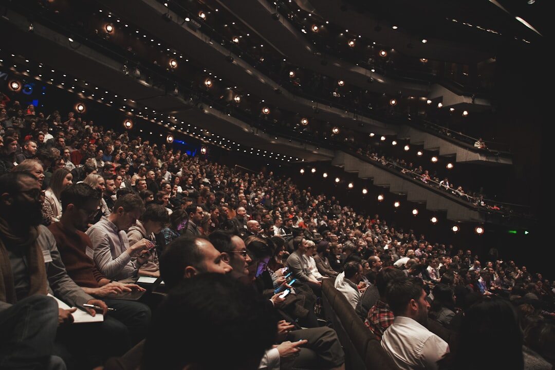 Large audience listening attentively at a conference